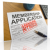 A membership application form with an 'APPROVED' stamp, lying on a wooden desk alongside a pen and a cup.